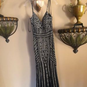 Black Gown embellished by silver crystal jewlery